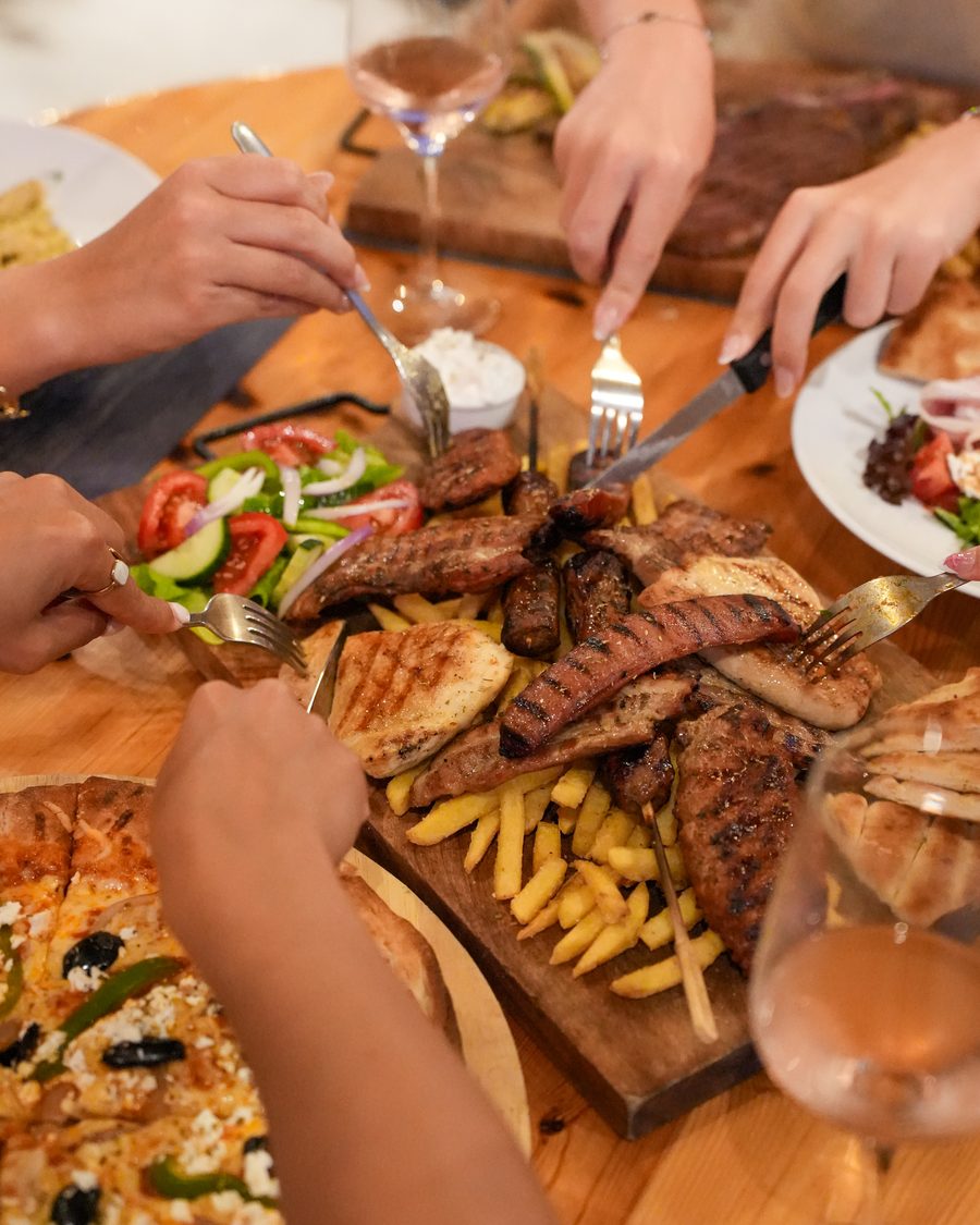 Sharing platter and dinner plates on a table at Starlight Kitchen in the evening
