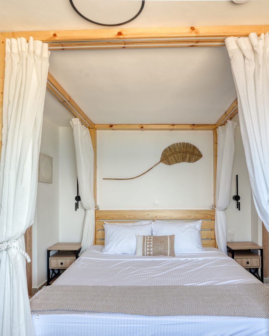 Four-poster bed in the Penthouse room at Starlight Ocean View
